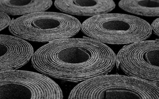 closeup-rolls-new-black-roofing-felt